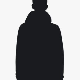 Silhouette of a person wearing a hoodie against a light background.